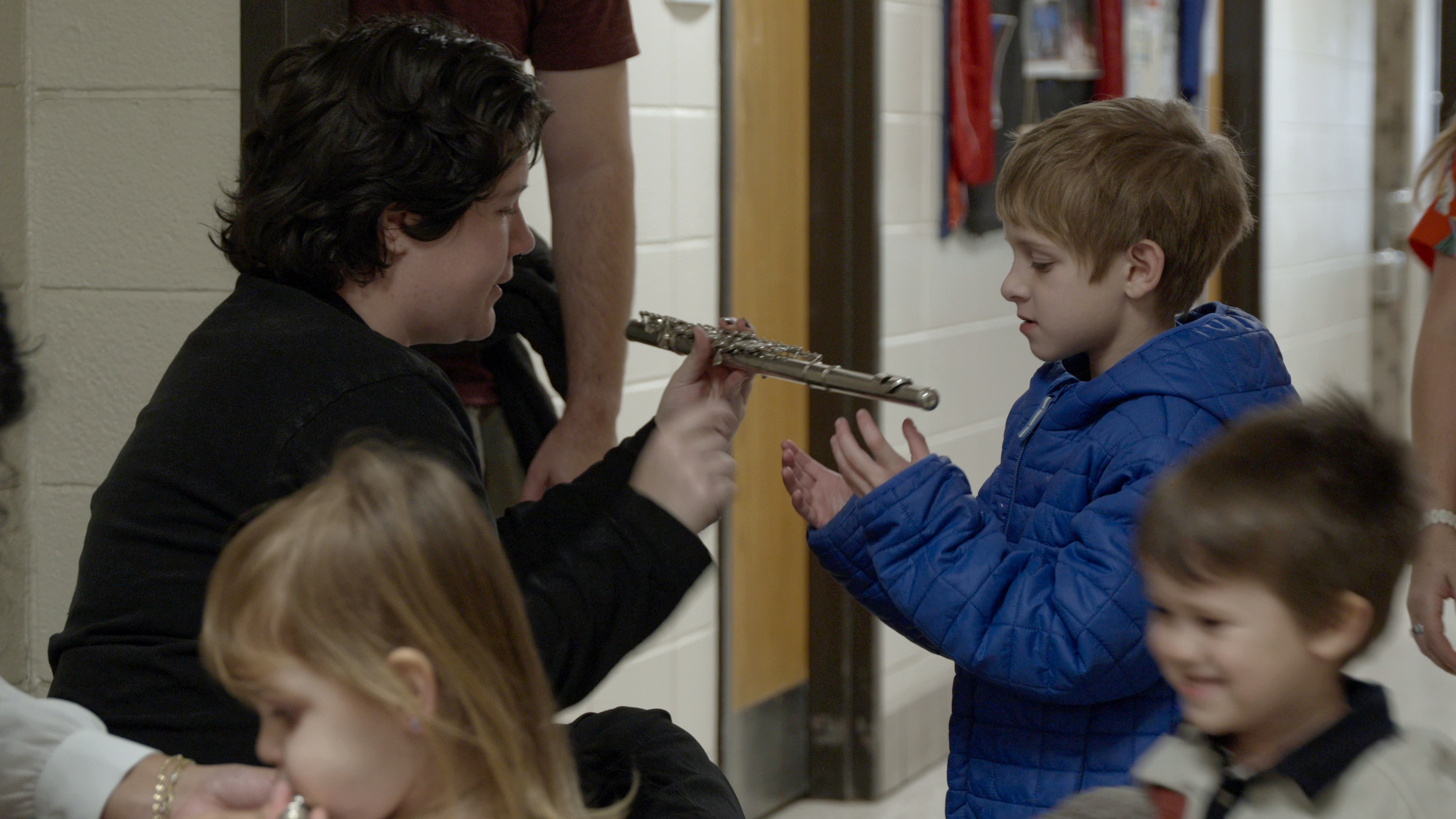 Children exploring instruments at the Tunes for Tots instrument petting zoo